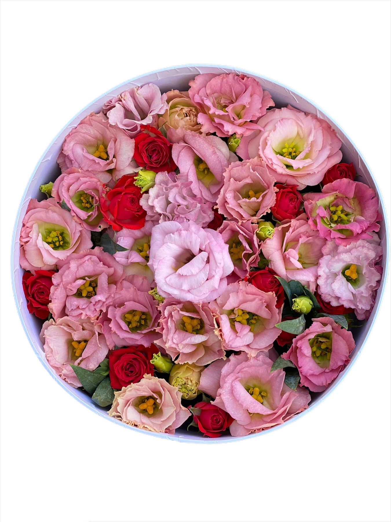 Кругла коробка з рожевою еустомою та кущовою червоною трояндою